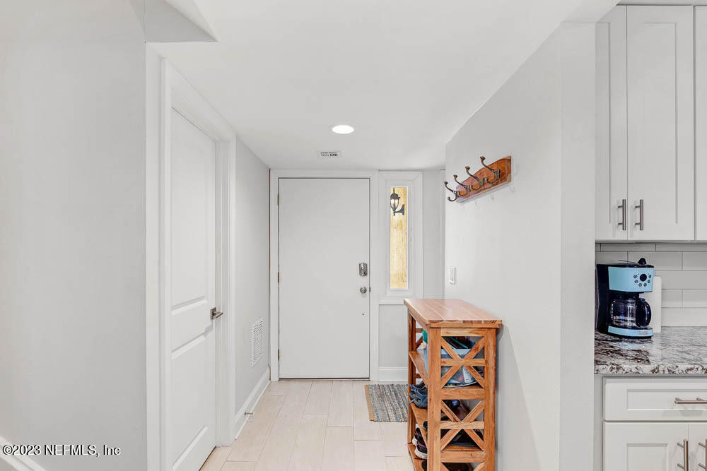 10 Cove Road Ponte Vedra Beach, FL 32082 - Photo 4 of 31 a view of an entryway with wooden floor