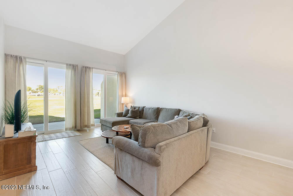10 Cove Road Ponte Vedra Beach, FL 32082 - Photo 7 of 31 a living room with furniture and a large window