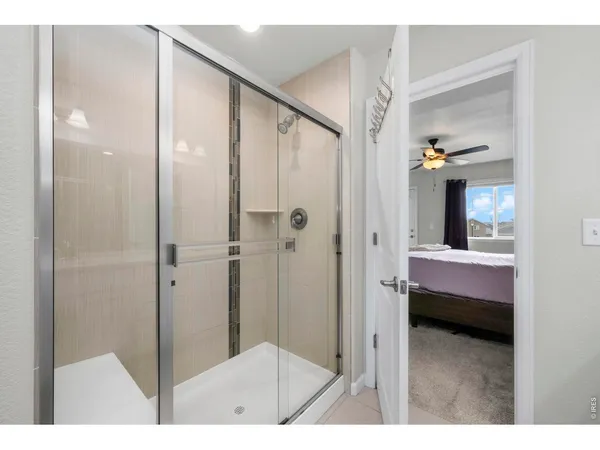 a view of a bathroom from a hallway
