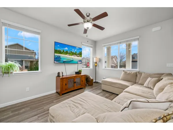 a living room with furniture and windows