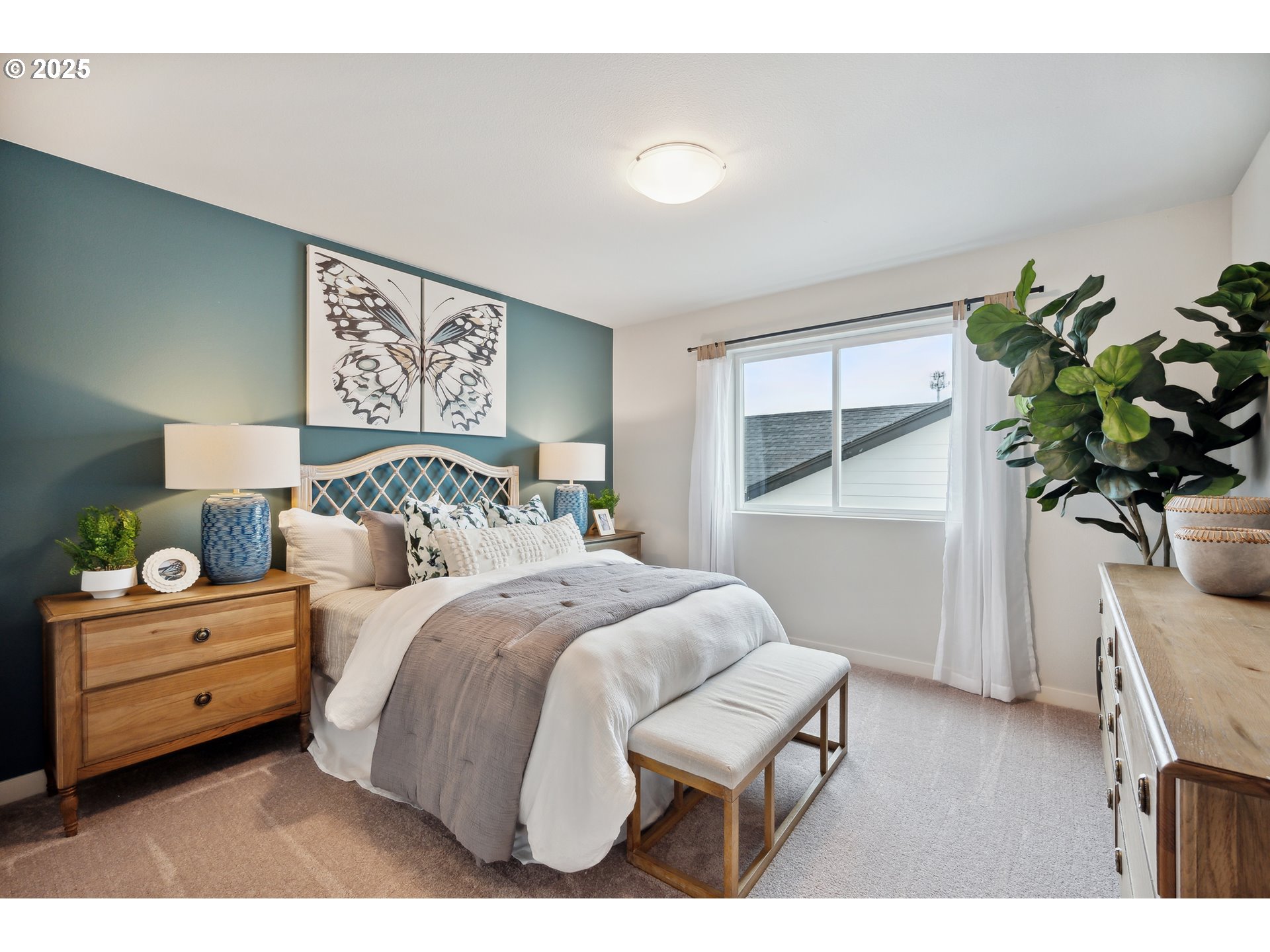 996 Legacy Lane Eugene, OR 97402 - Photo 14 of 37 a bedroom with a bed and a potted plant