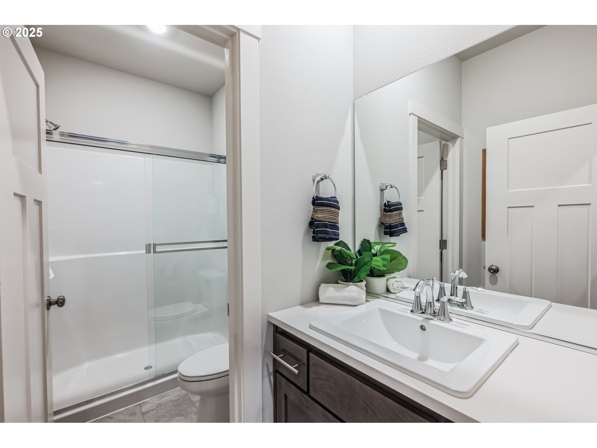996 Legacy Lane Eugene, OR 97402 - Photo 17 of 37 a bathroom with a sink mirror toilet and shower