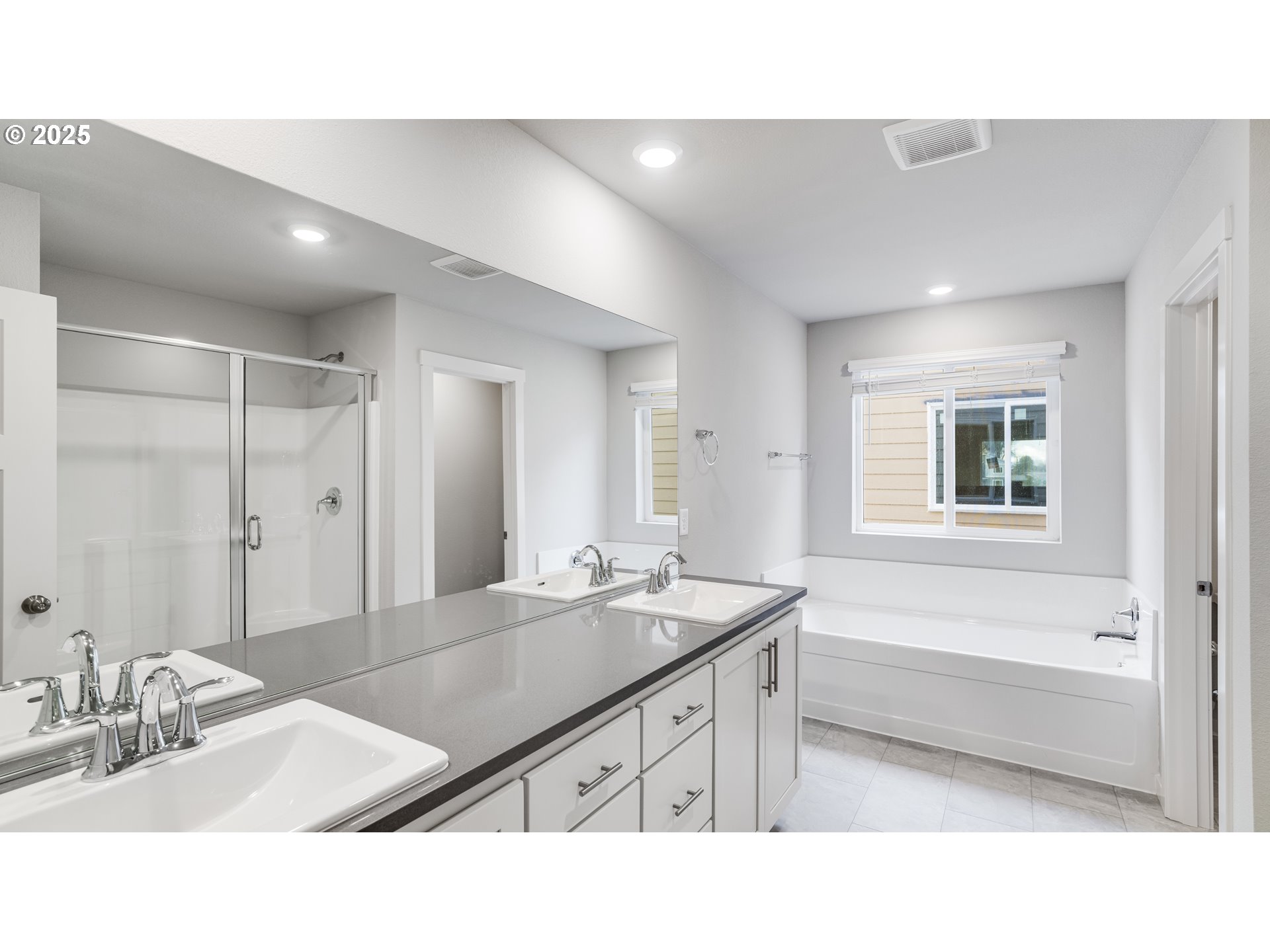 996 Legacy Lane Eugene, OR 97402 - Photo 19 of 37 a bathroom with a sink a large mirror and a shower