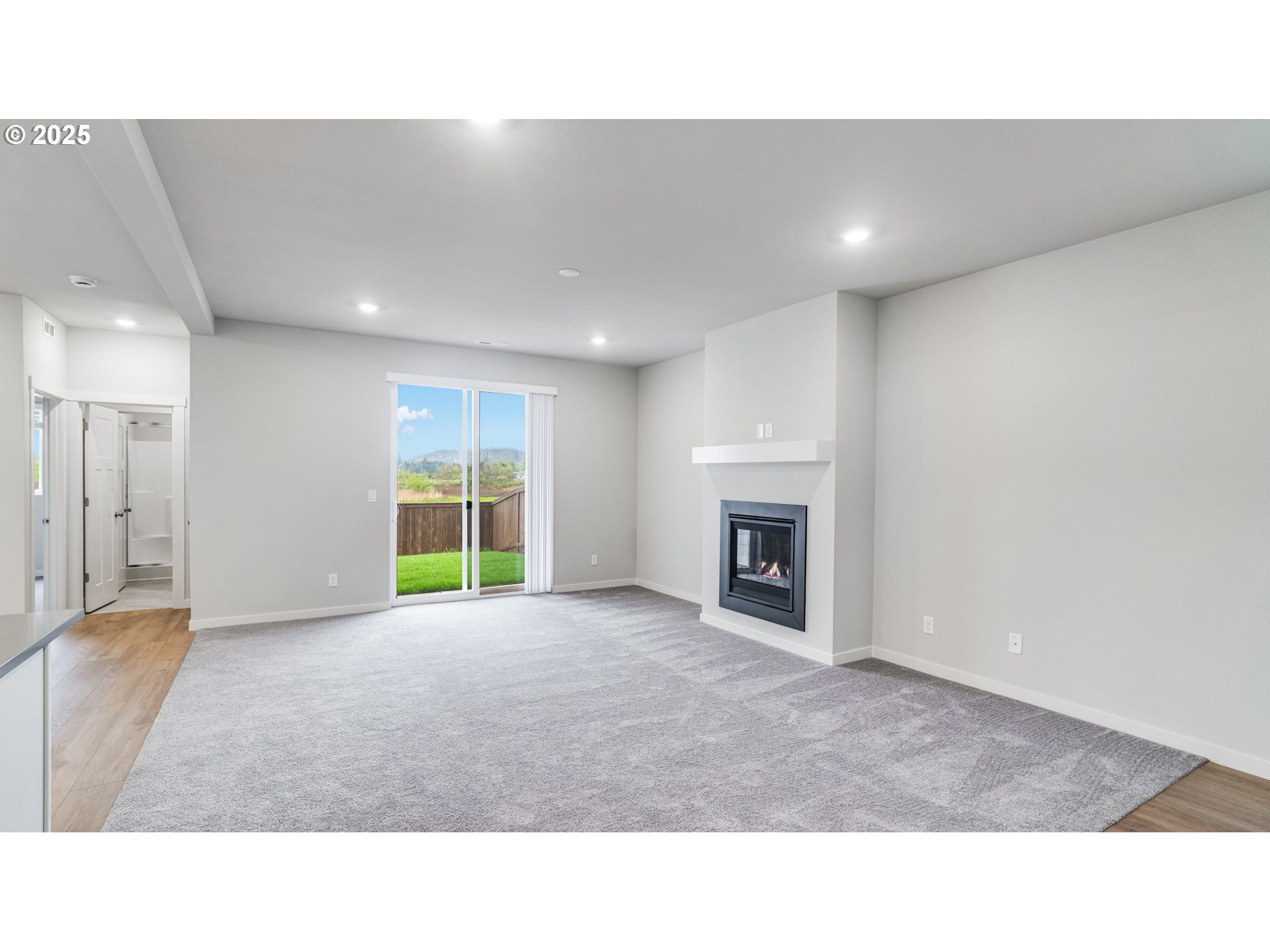 996 Legacy Lane Eugene, OR 97402 - Photo 21 of 37 a open hall with a fireplace