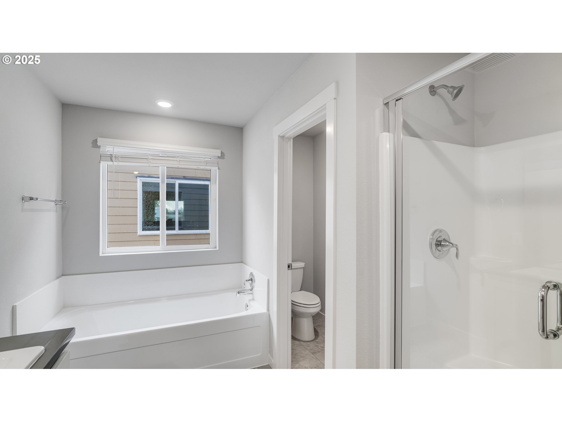 996 Legacy Lane Eugene, OR 97402 - Photo 25 of 37 a bathroom with a sink tub shower and a mirror