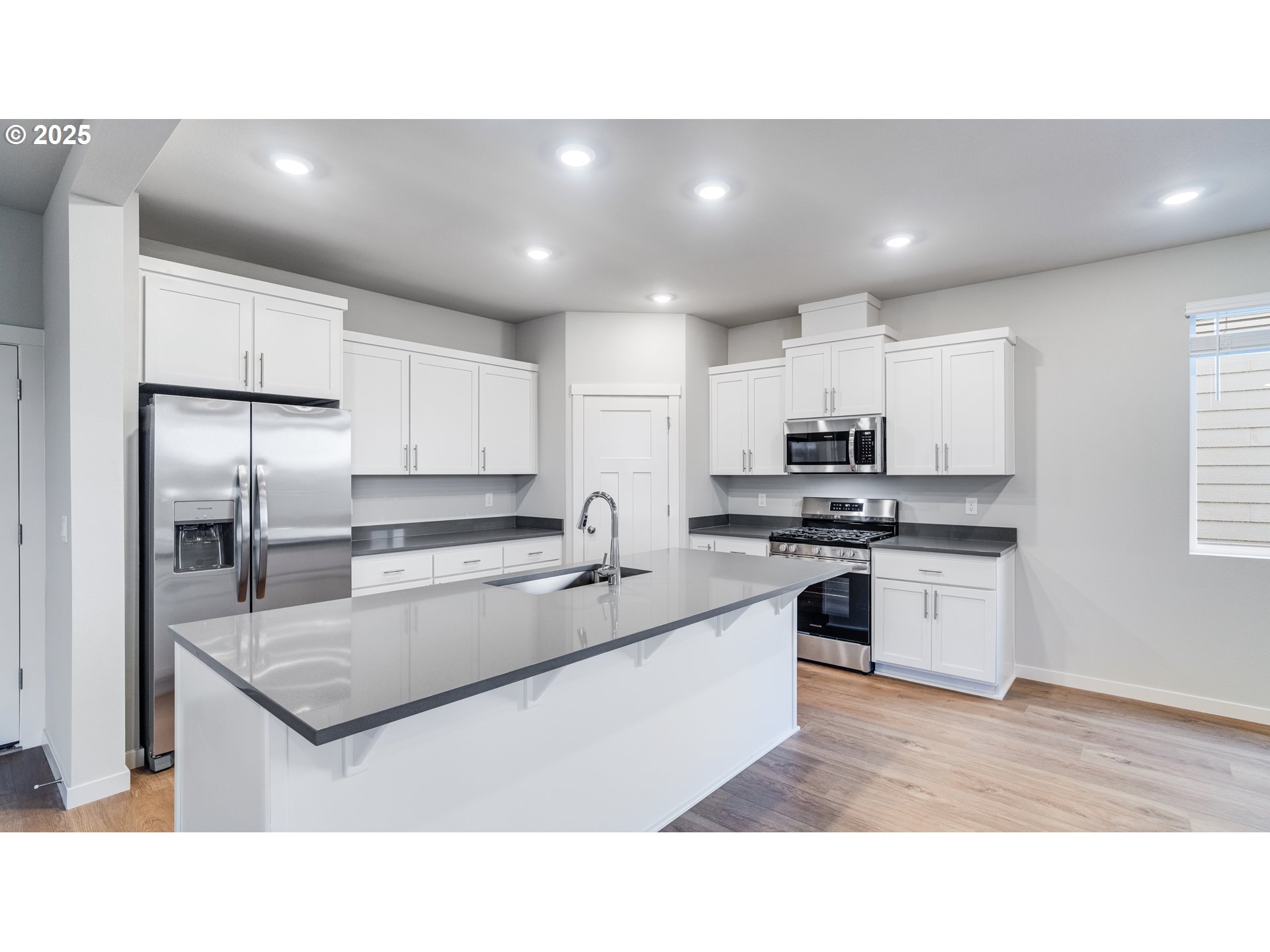 996 Legacy Lane Eugene, OR 97402 - Photo 26 of 37 a kitchen with stainless steel appliances granite countertop a sink a stove a refrigerator and cabinets