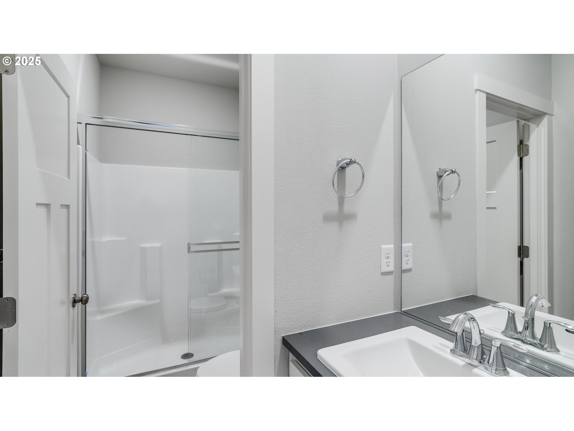 996 Legacy Lane Eugene, OR 97402 - Photo 30 of 37 a bathroom with a sink a shower and a mirror