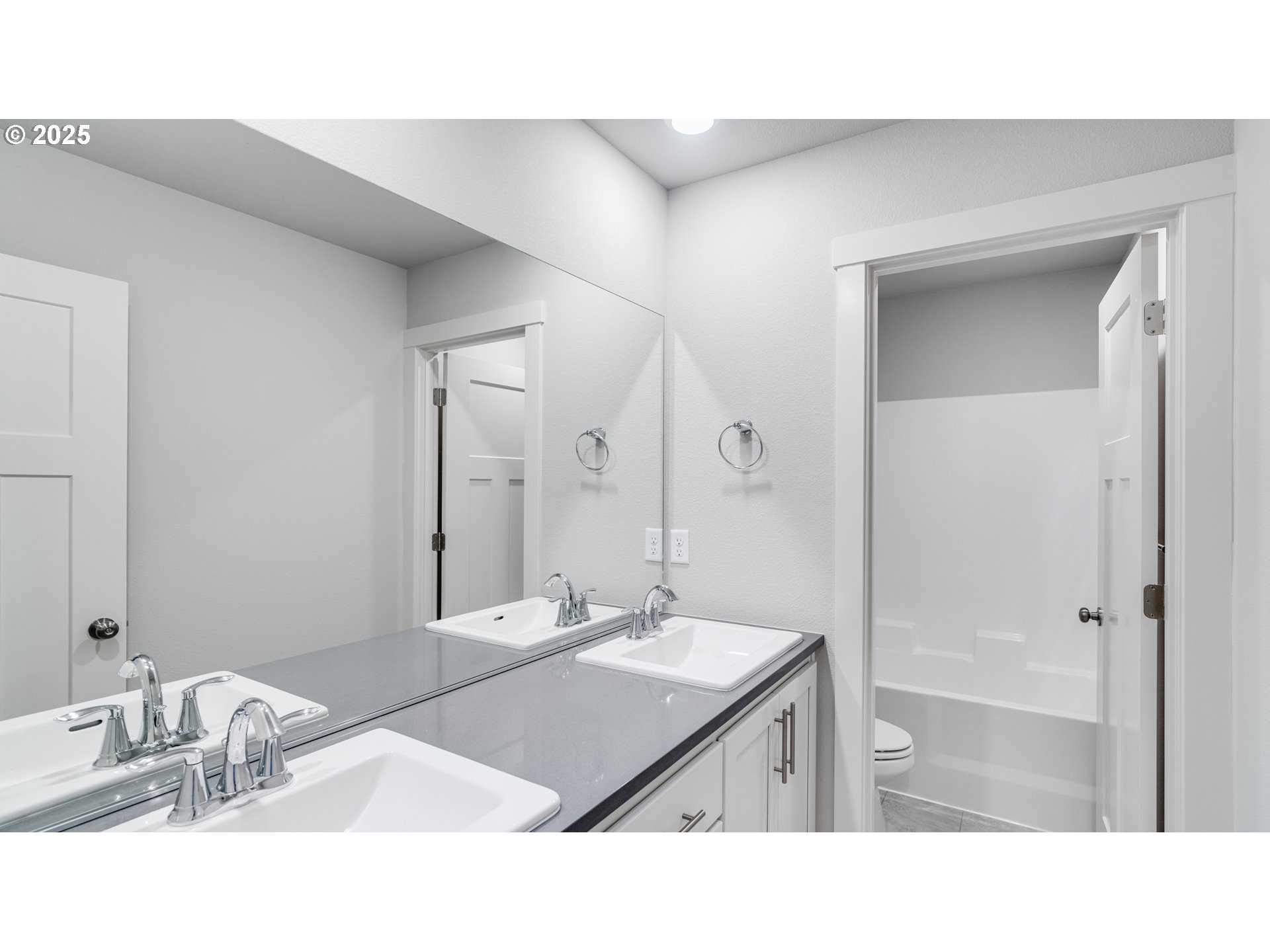 996 Legacy Lane Eugene, OR 97402 - Photo 35 of 37 a bathroom with a sink double vanity and a mirror