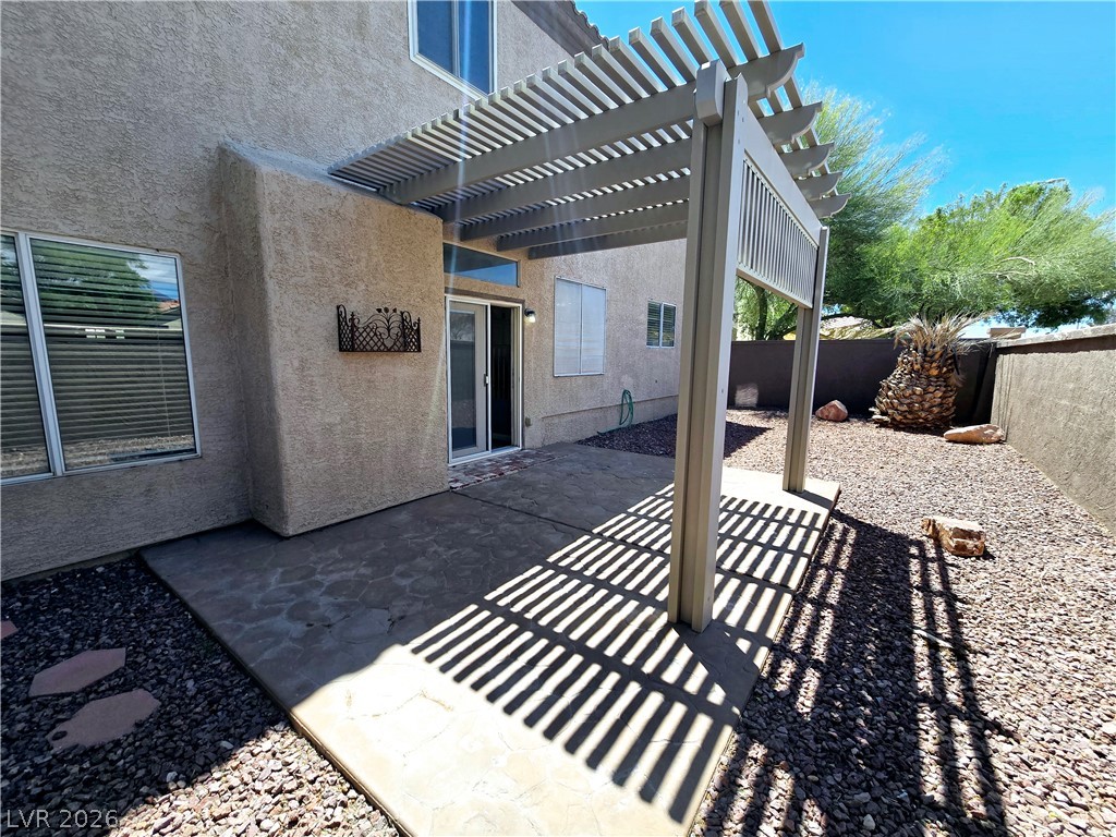 3759 Funston Way Las Vegas, NV 89129 - Photo 17 of 31 A private backyard oasis features a shaded patio and drought-tolerant landscaping.