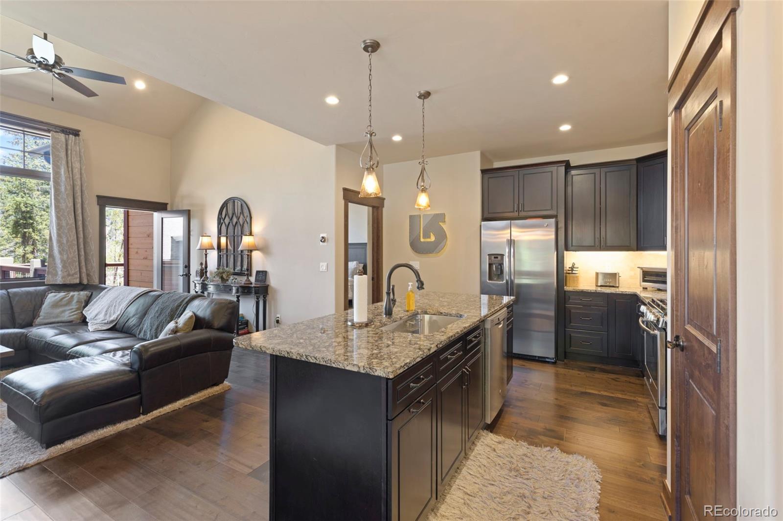 799 Independence Road Keystone, CO 80435 - Photo 14 of 44 a large kitchen with kitchen island a large counter top stainless steel appliances and cabinets