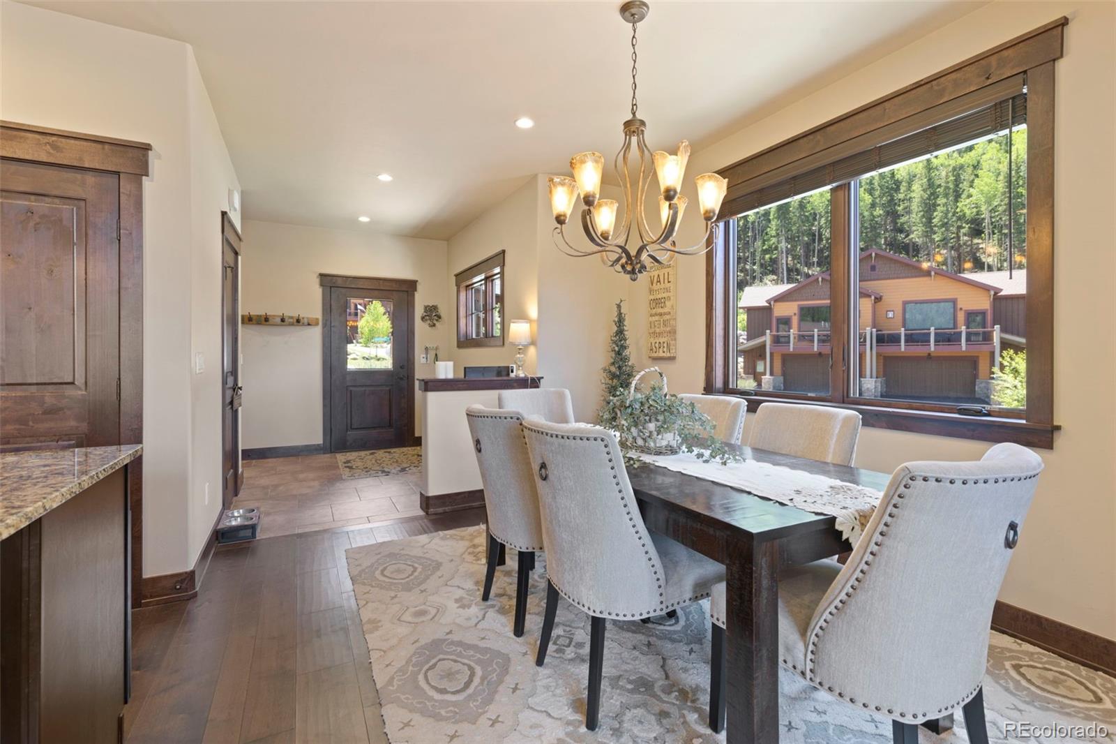 799 Independence Road Keystone, CO 80435 - Photo 16 of 44 a view of a dining room with furniture window and wooden floor