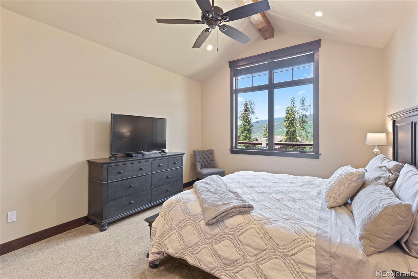 799 Independence Road Keystone, CO 80435 - Photo 22 of 44 a bedroom with a large bed and a flat screen tv