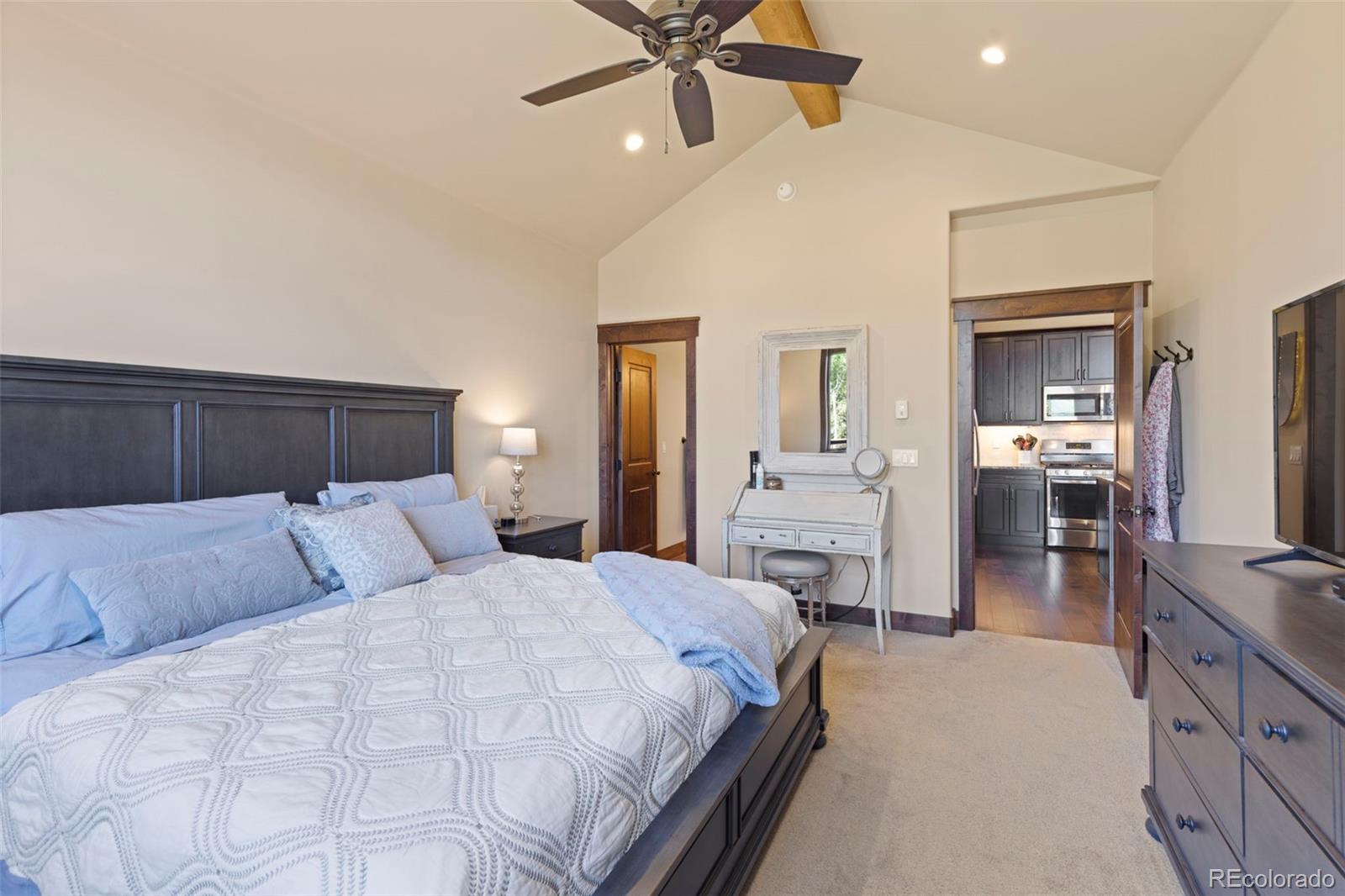799 Independence Road Keystone, CO 80435 - Photo 23 of 44 a bedroom with a bed and a chandelier