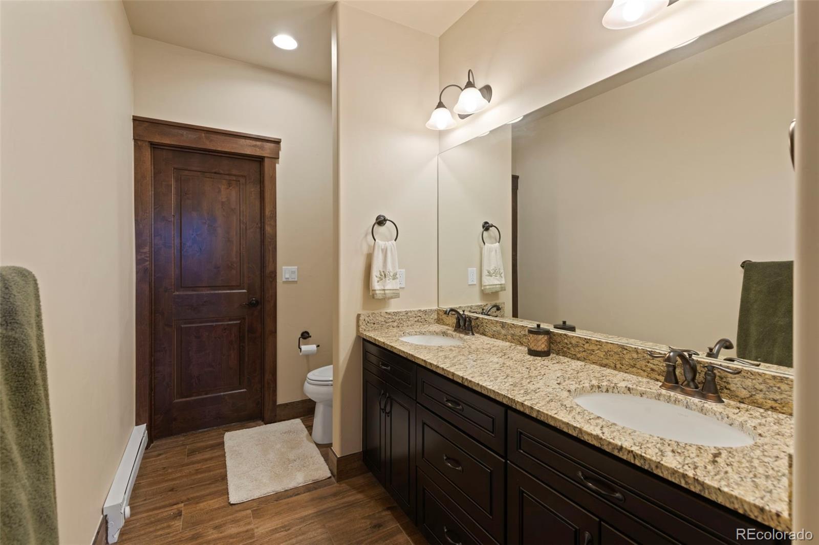 799 Independence Road Keystone, CO 80435 - Photo 25 of 44 a bathroom with a granite countertop sink and a mirror