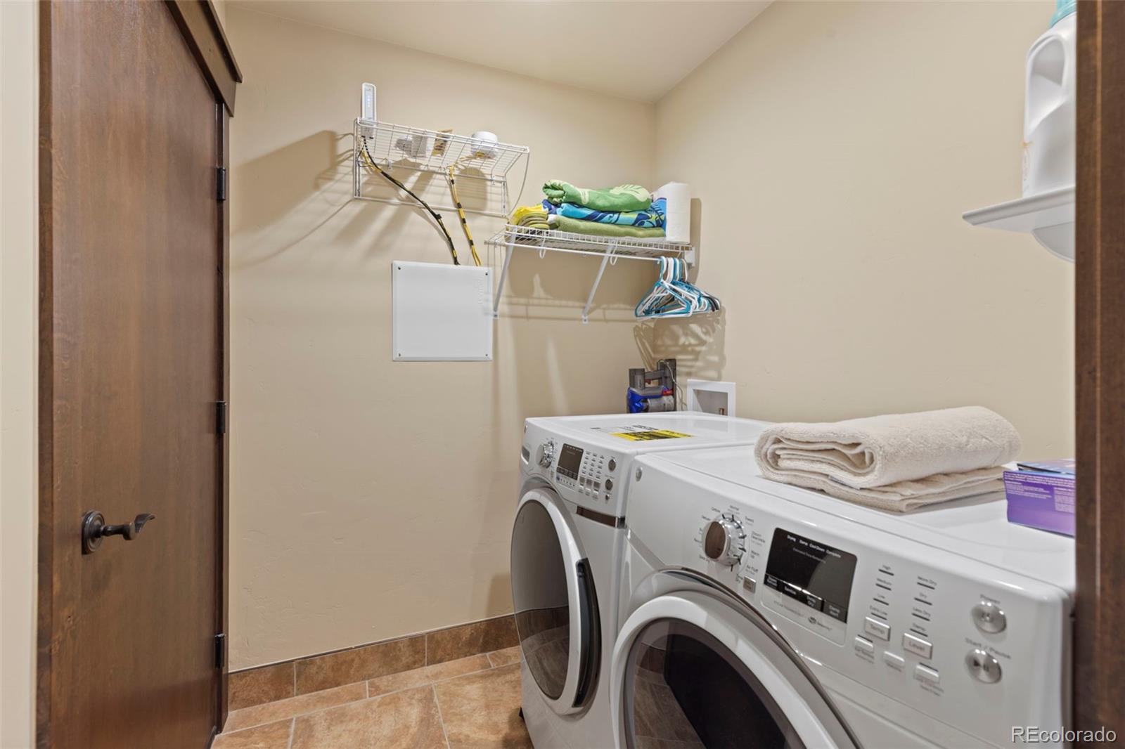 799 Independence Road Keystone, CO 80435 - Photo 35 of 44 a utility room with dryer and washer