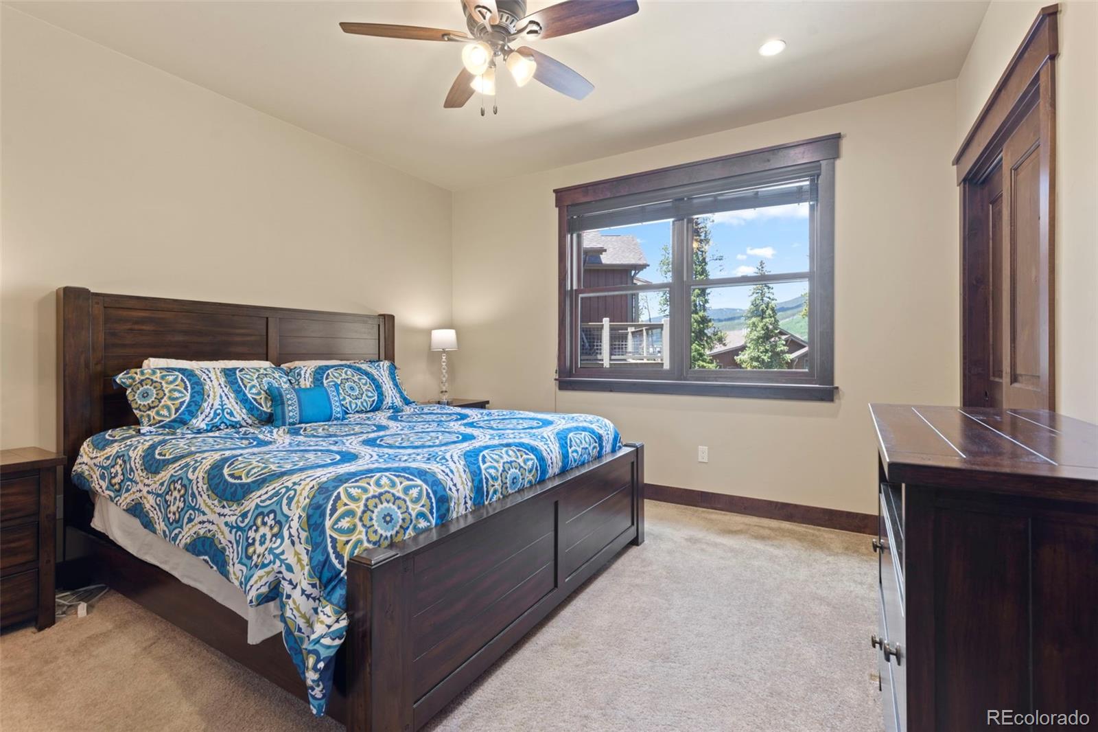 799 Independence Road Keystone, CO 80435 - Photo 38 of 44 a bedroom with a large bed and a window