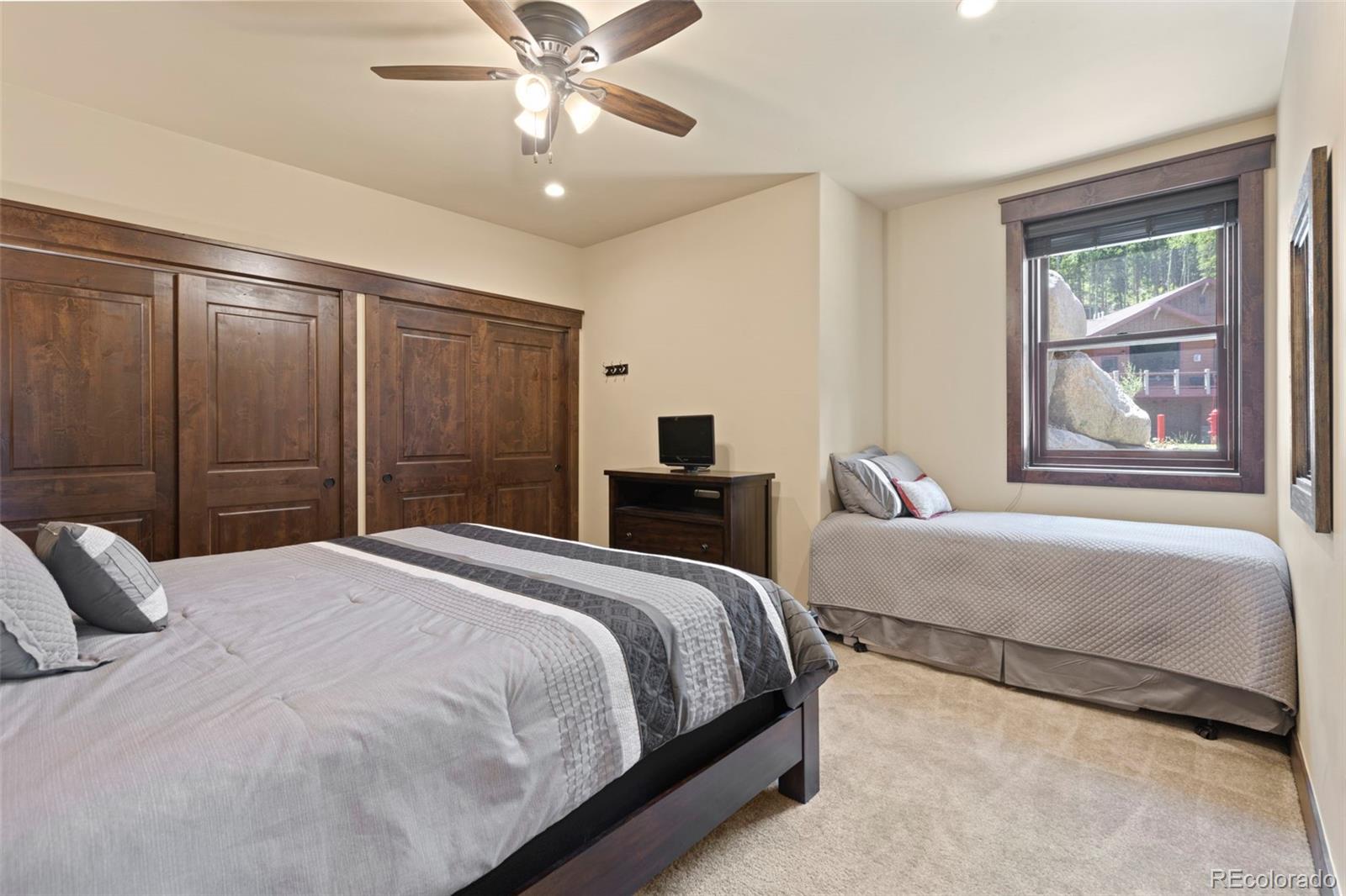 799 Independence Road Keystone, CO 80435 - Photo 41 of 44 a bedroom with a large bed and a window