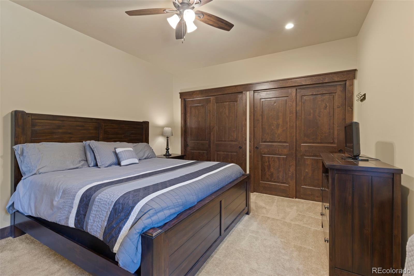799 Independence Road Keystone, CO 80435 - Photo 42 of 44 a bedroom with a bed and cabinets