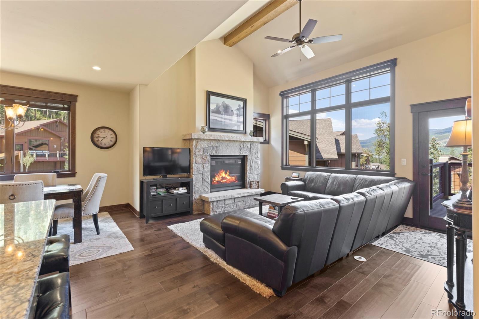 799 Independence Road Keystone, CO 80435 - Photo 7 of 44 a living room with furniture a large window and a fireplace
