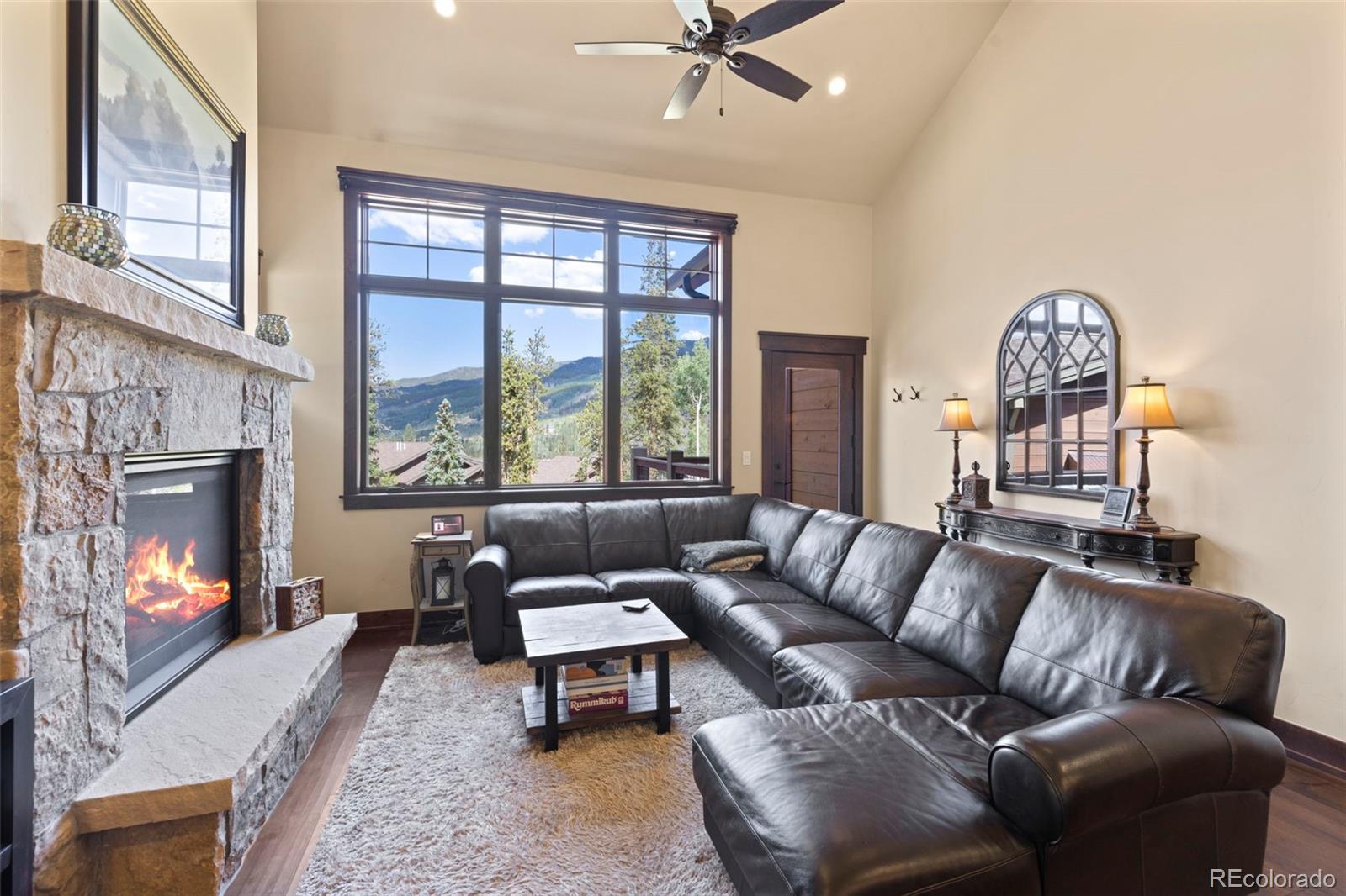 799 Independence Road Keystone, CO 80435 - Photo 9 of 44 a living room with furniture a fireplace and a large window
