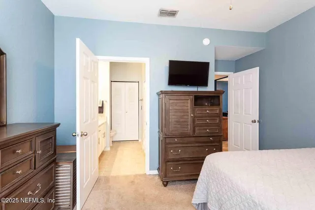 a bedroom with a bed and furniture