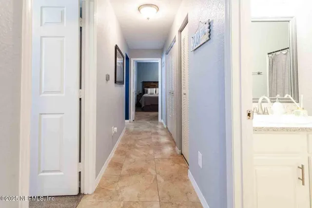 a view of a bathroom from a hallway