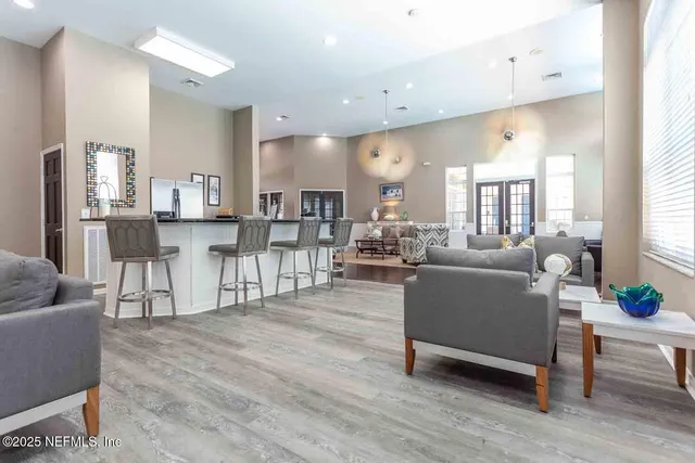 a living room with furniture and a table