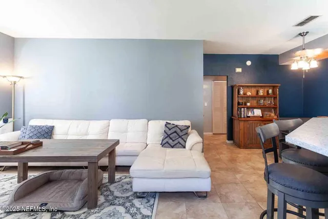 a living room with furniture and a table