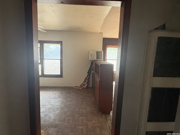 a view of hallway with windows