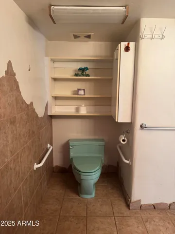 a bathroom with a toilet and a sink