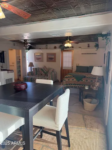 a kitchen with a table chairs and a stove