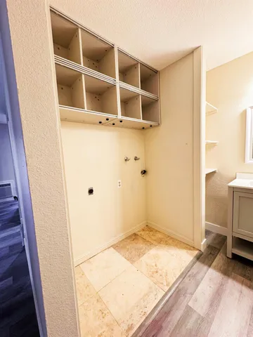 a view of a storage & utility room with a sink