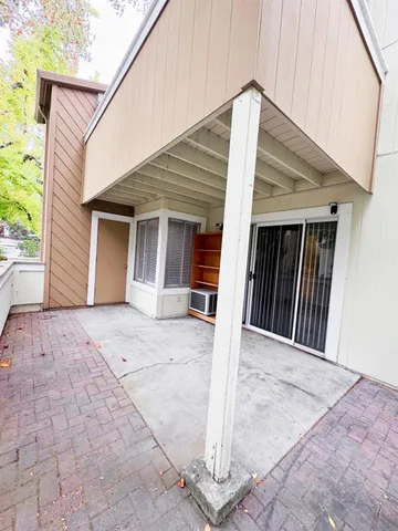 a view of a house with wooden floor and a ceiling fan