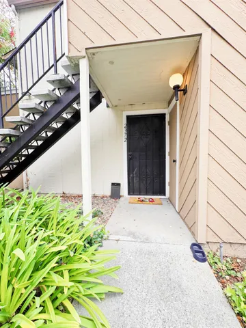 a view of a house with a street