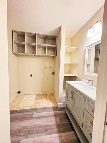 a bathroom with a tub sink and shower