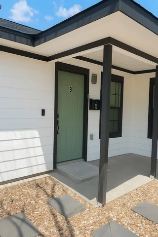 a view of a garden with wooden fence
