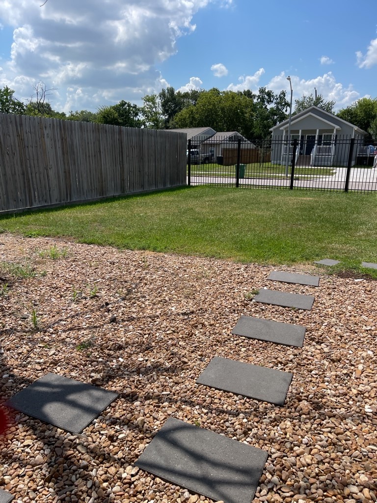 7317 Briefway Street, Unit B Houston, TX 77087 - Photo 2 of 13 a view of a garden with wooden fence