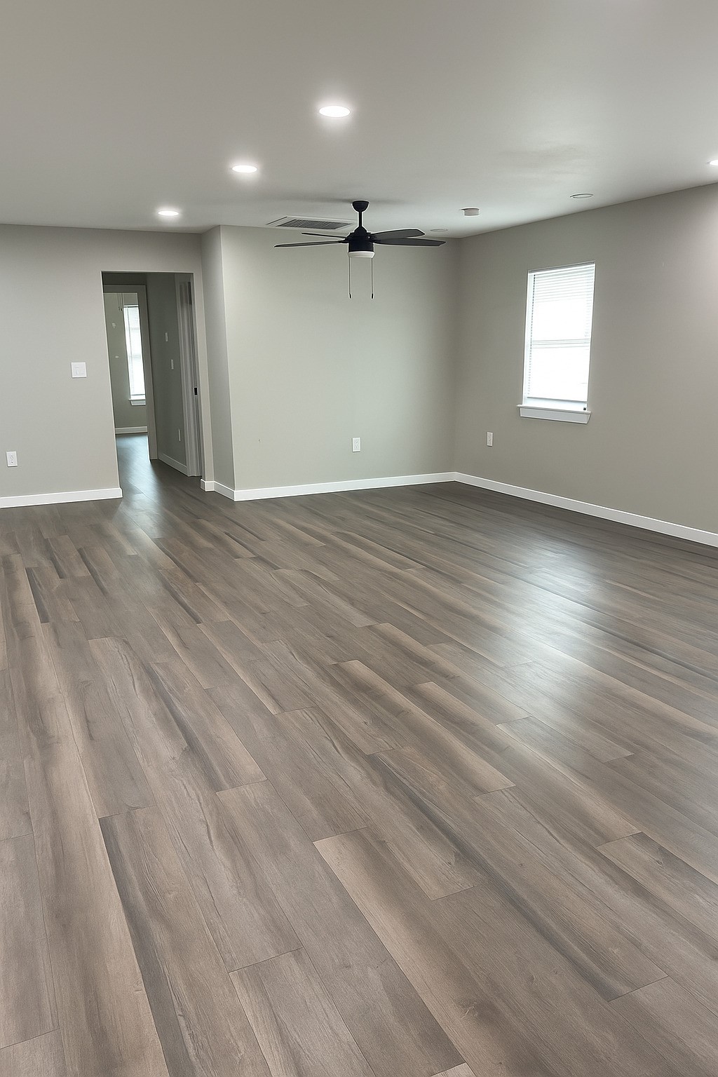 7317 Briefway Street, Unit B Houston, TX 77087 - Photo 4 of 13 an empty room with wooden floor and windows