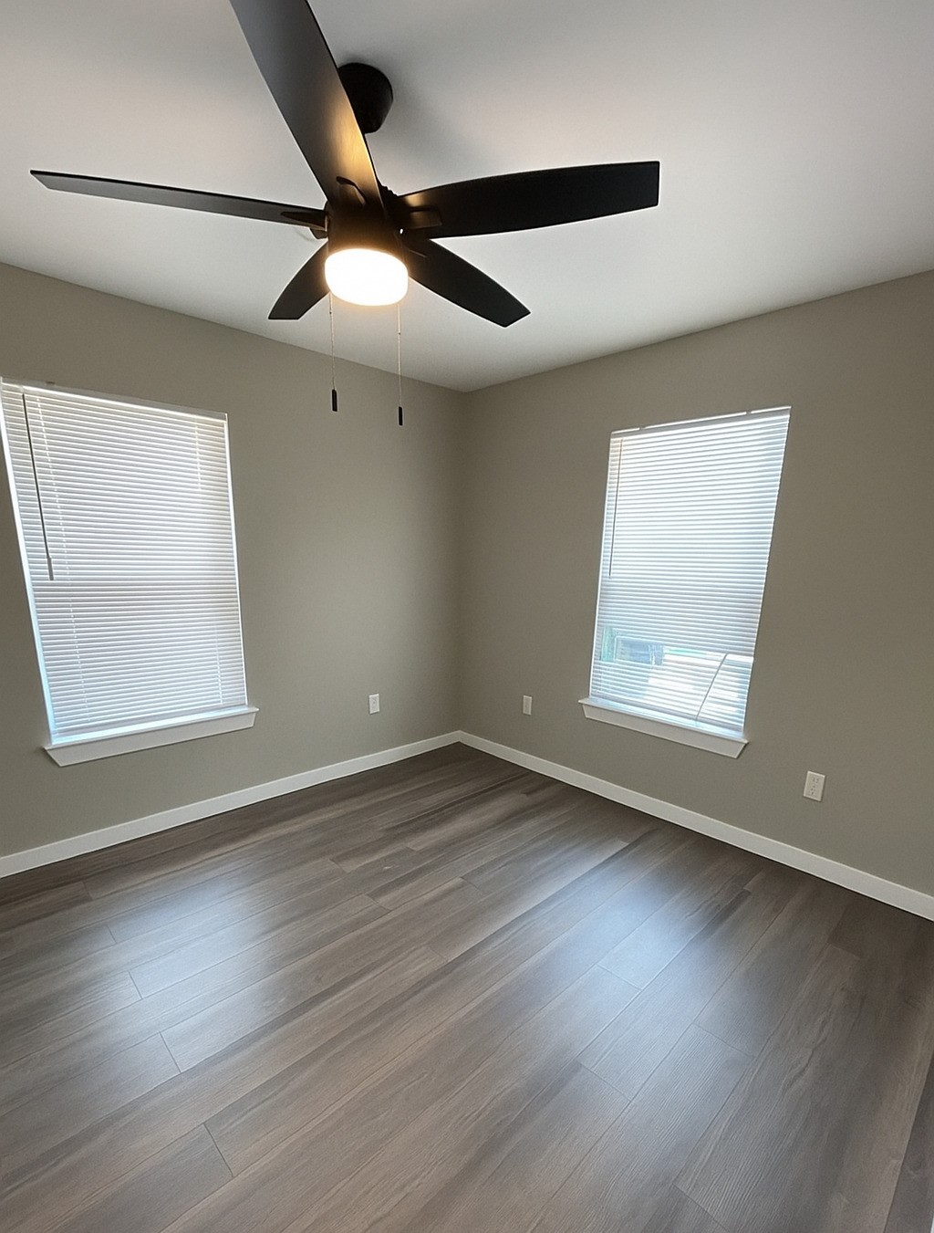 7317 Briefway Street, Unit B Houston, TX 77087 - Photo 6 of 13 a view of an empty room with wooden floor and a window