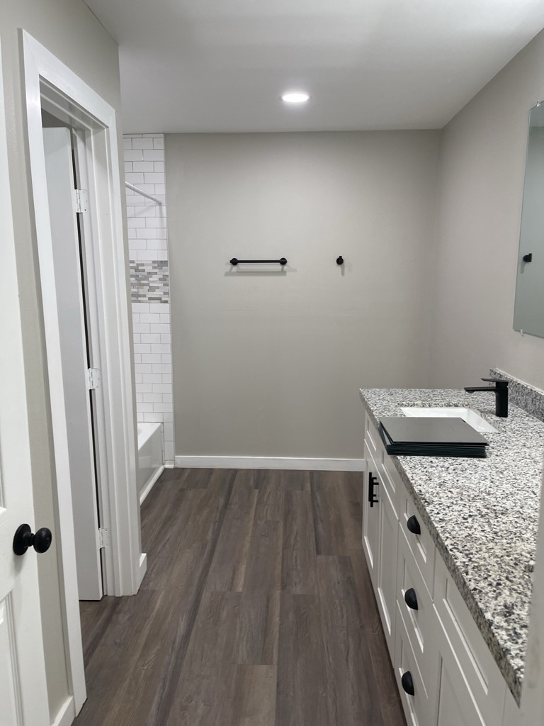 7317 Briefway Street, Unit B Houston, TX 77087 - Photo 7 of 13 an empty room with wooden floor