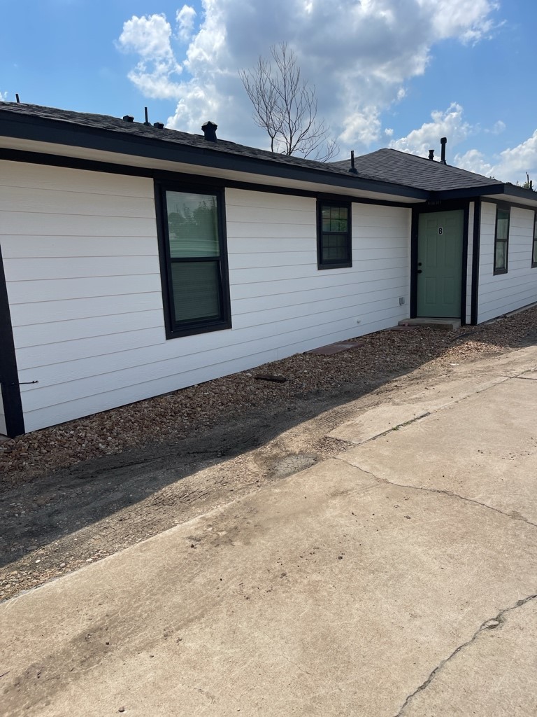 7317 Briefway Street, Unit B Houston, TX 77087 - Photo 9 of 13 a front view of a house with a yard