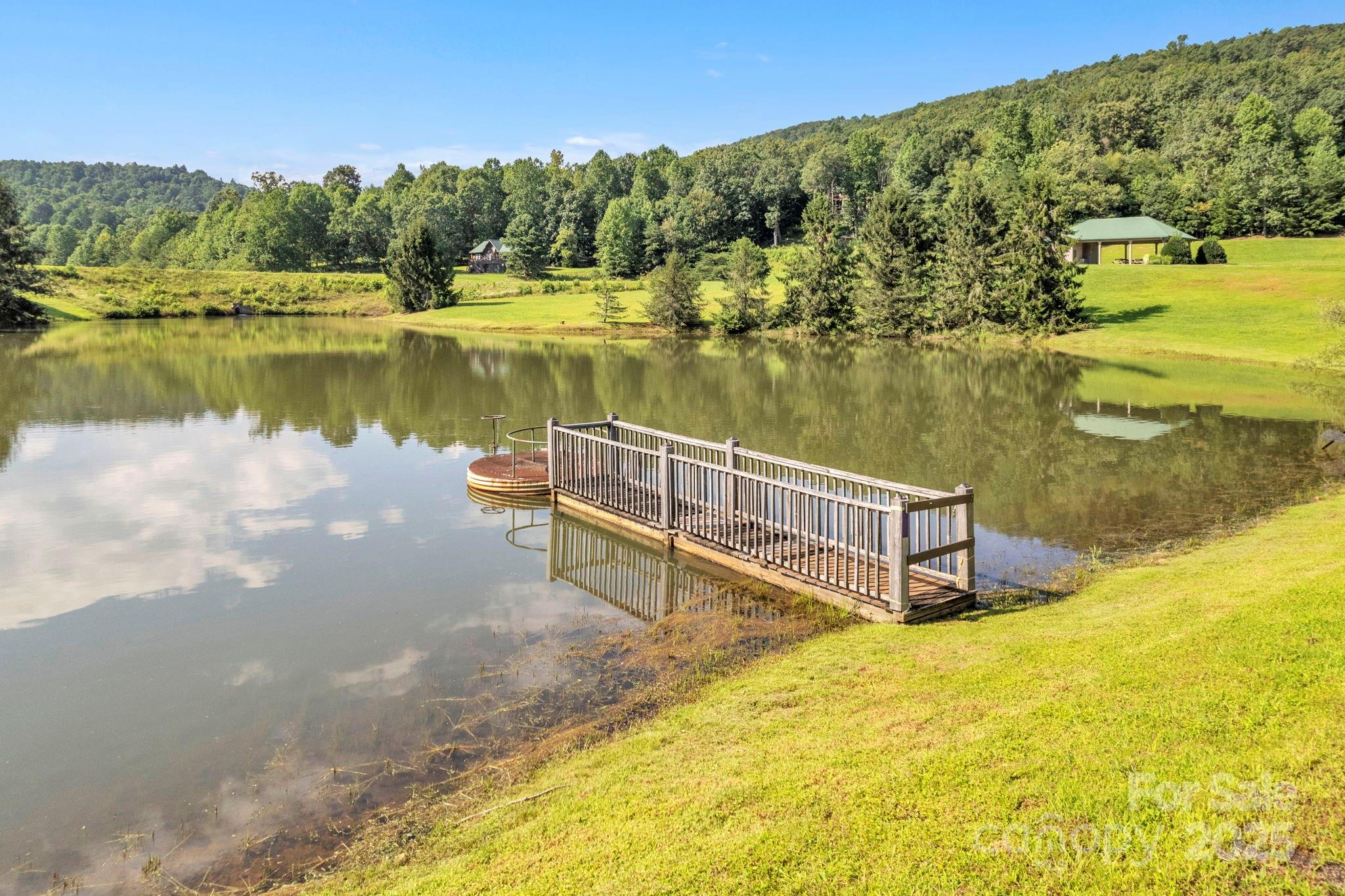 Lot 12 Sunset Ridge Drive, Unit LOT 12 Columbus, NC 28722 - Photo 8 of 10 a view of a lake with a mountain