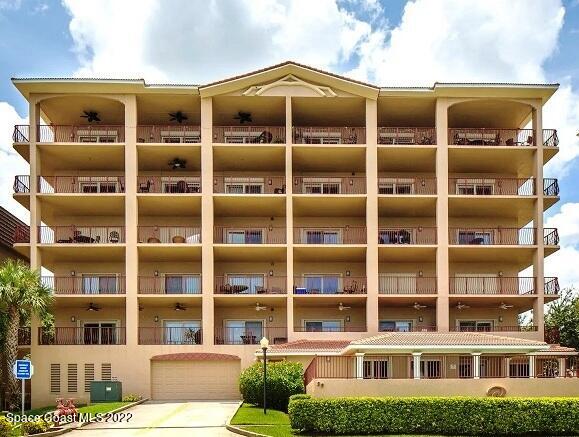 29 Riverside Drive, Unit 302 Cocoa, FL 32922 - Photo 2 of 56 a front view of a building with a garden