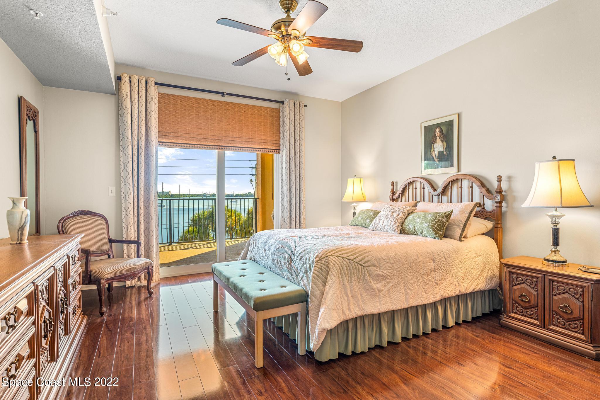 29 Riverside Drive, Unit 302 Cocoa, FL 32922 - Photo 28 of 56 a bedroom with furniture and a large window