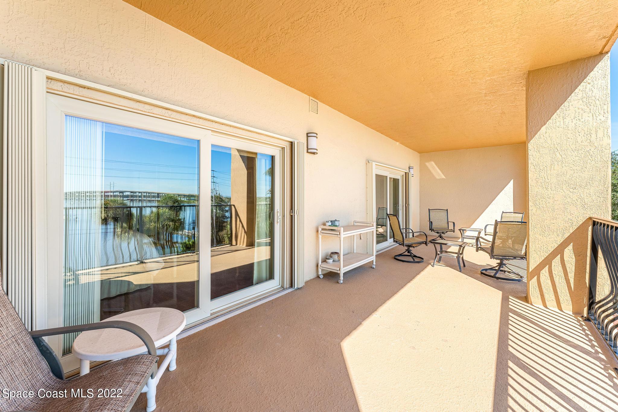 29 Riverside Drive, Unit 302 Cocoa, FL 32922 - Photo 36 of 56 a bedroom with furniture and a large window