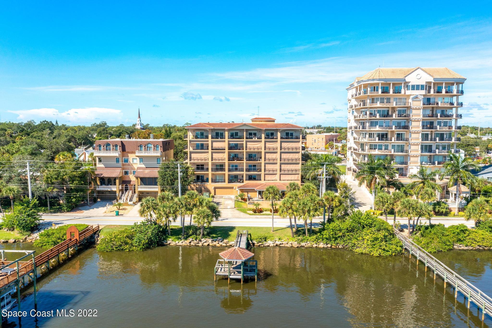 29 Riverside Drive, Unit 302 Cocoa, FL 32922 - Photo 51 of 56 a view of a lake with a building