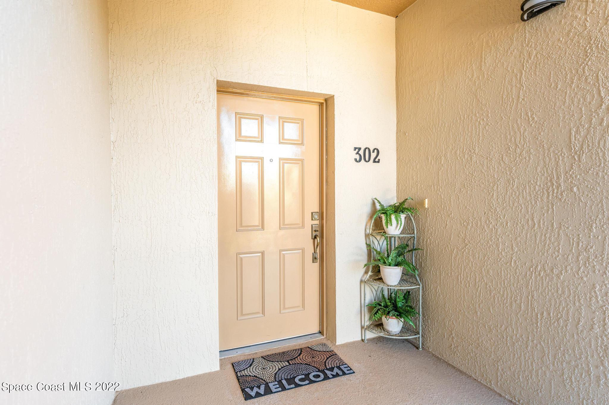 29 Riverside Drive, Unit 302 Cocoa, FL 32922 - Photo 6 of 56 a view of a entryway with wooden floor