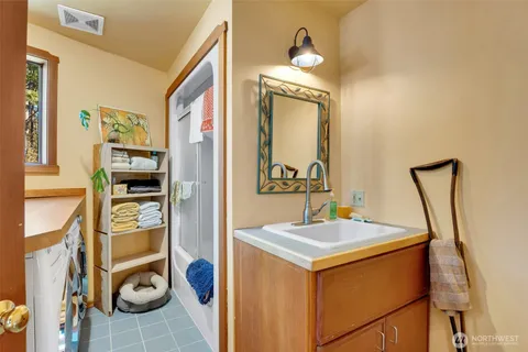 a view of an entryway with furniture and mirror next to a window