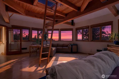 a view of balcony with wooden floor and fence