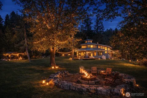 a living room with furniture a rug and a window